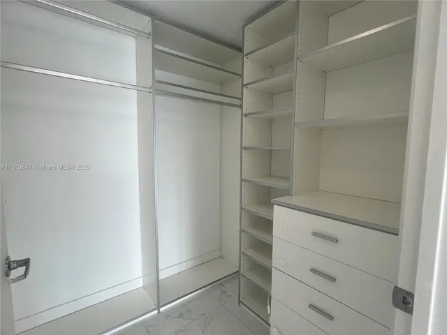 a view of an empty walk in closet