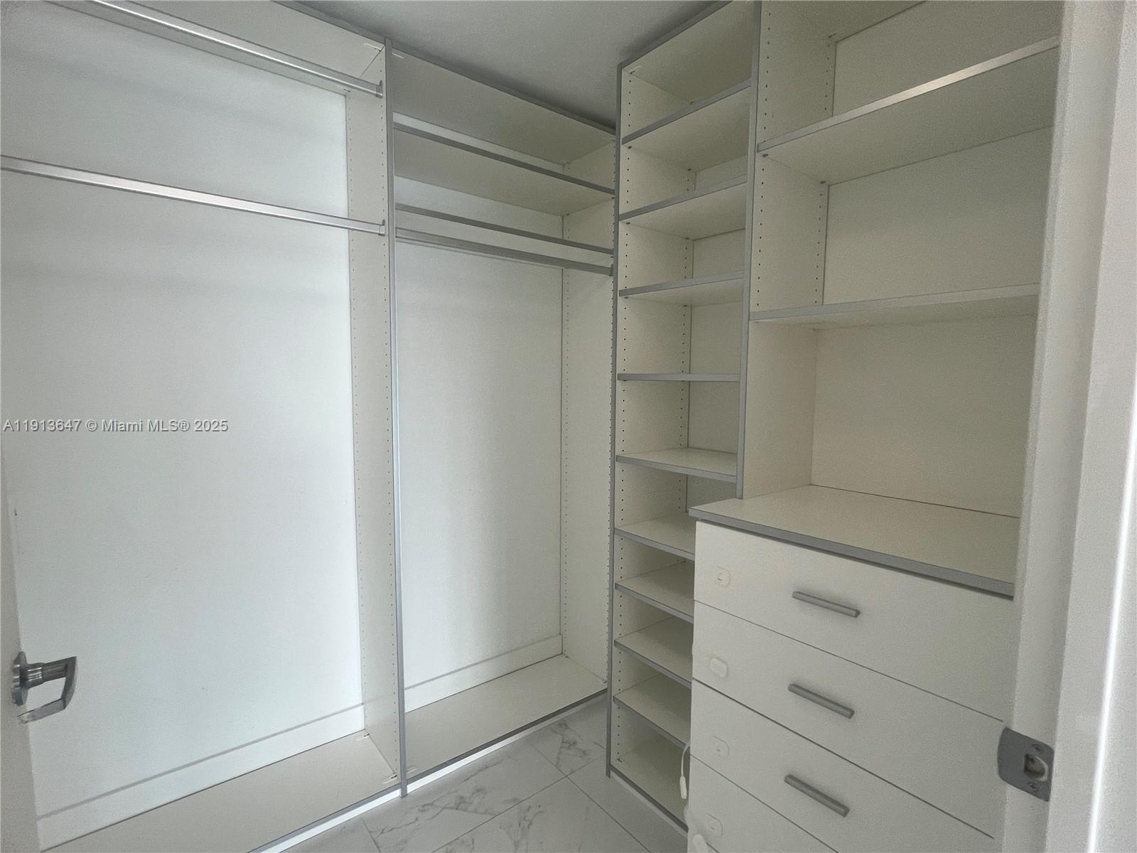 92 Southwest 3rd Street, Unit 3803 Miami, FL 33130 - Photo 11 of 27 a view of an empty walk in closet