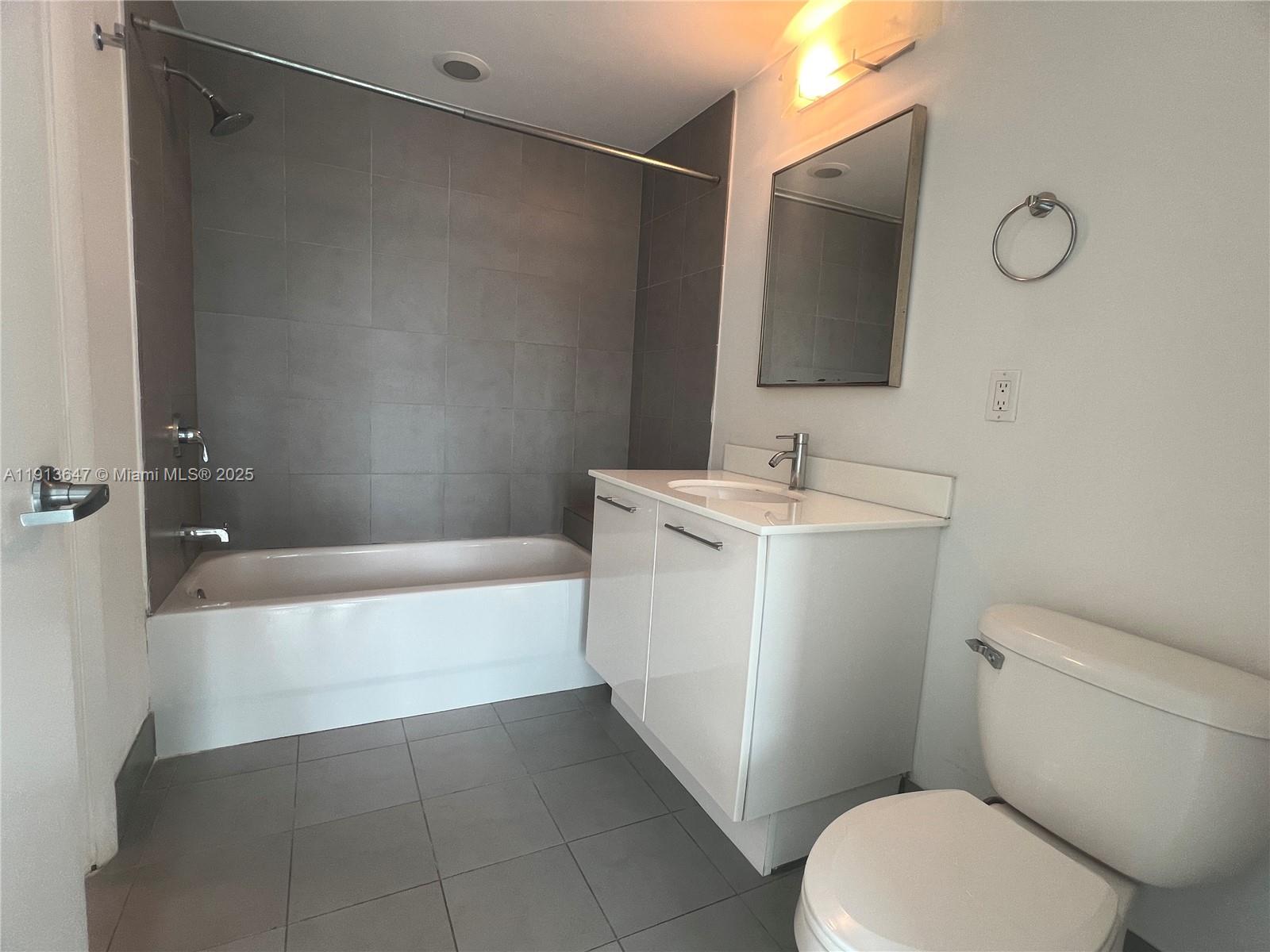 92 Southwest 3rd Street, Unit 3803 Miami, FL 33130 - Photo 20 of 27 a bathroom with a sink toilet and shower