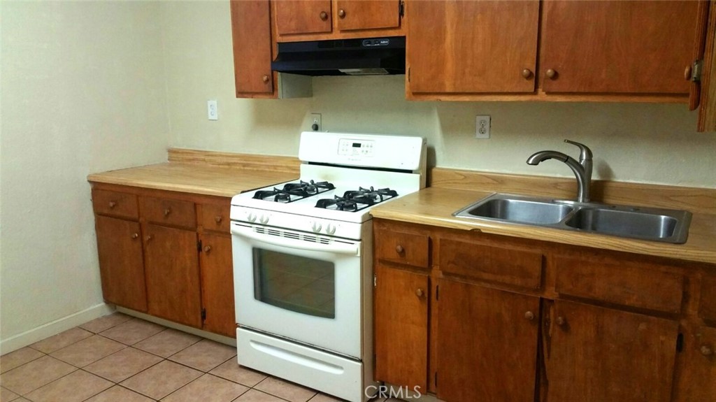 14650 Boyle Avenue Fontana, CA 92337 - Photo 11 of 15 a kitchen with a stove and a sink