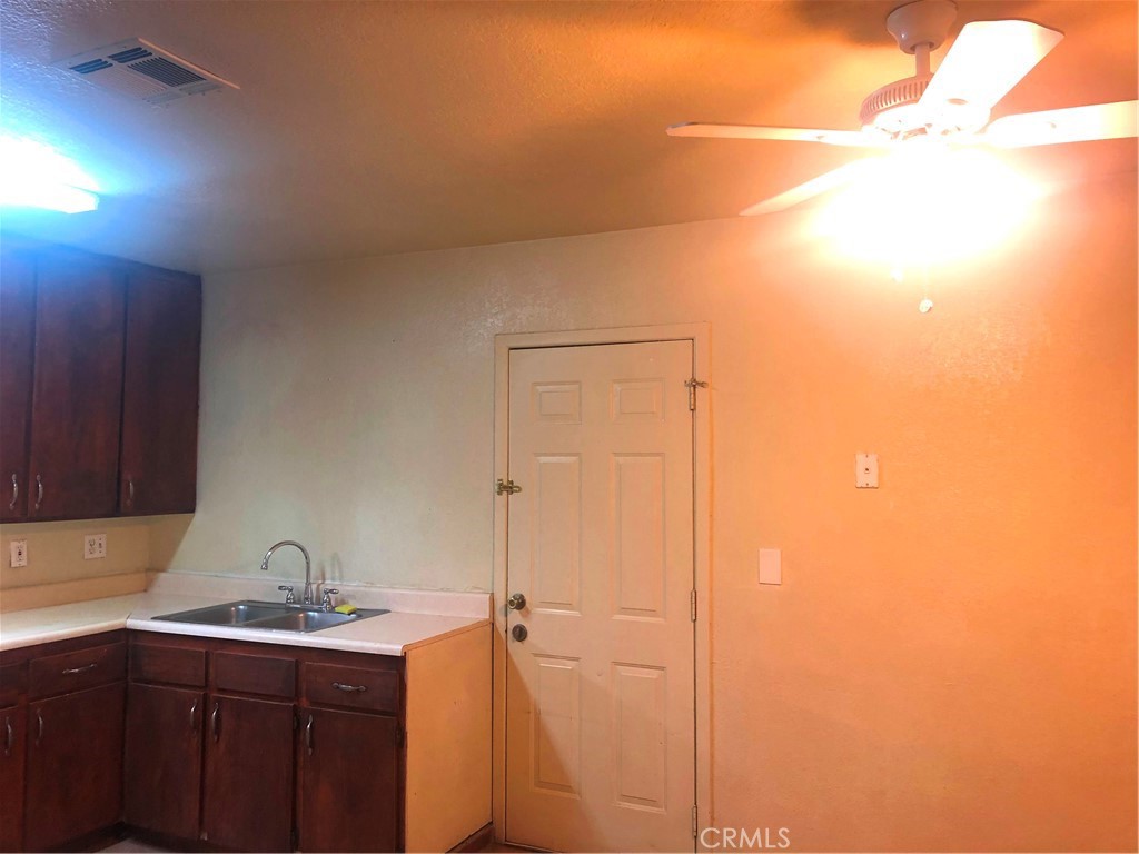 14650 Boyle Avenue Fontana, CA 92337 - Photo 4 of 15 a view of storage and utility room with two washing machine