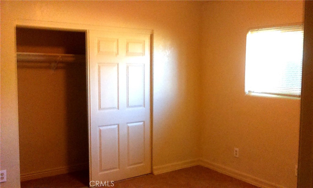 14650 Boyle Avenue Fontana, CA 92337 - Photo 7 of 15 an empty room with windows