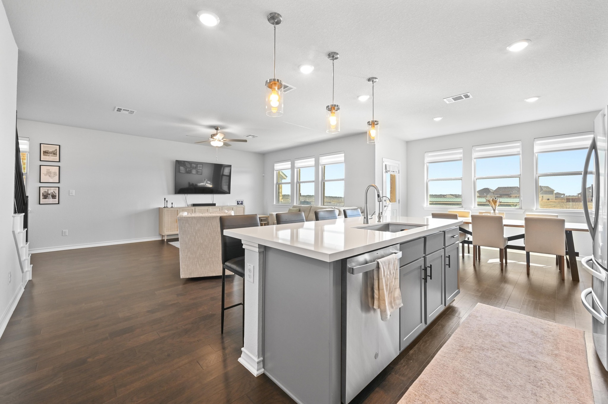 116 Small Seed Drive Buda, TX 78610 - Photo 11 of 40 Kitchen featuring pendant lighting, a kitchen breakfast bar, stainless steel appliances, and dark wood-style floors