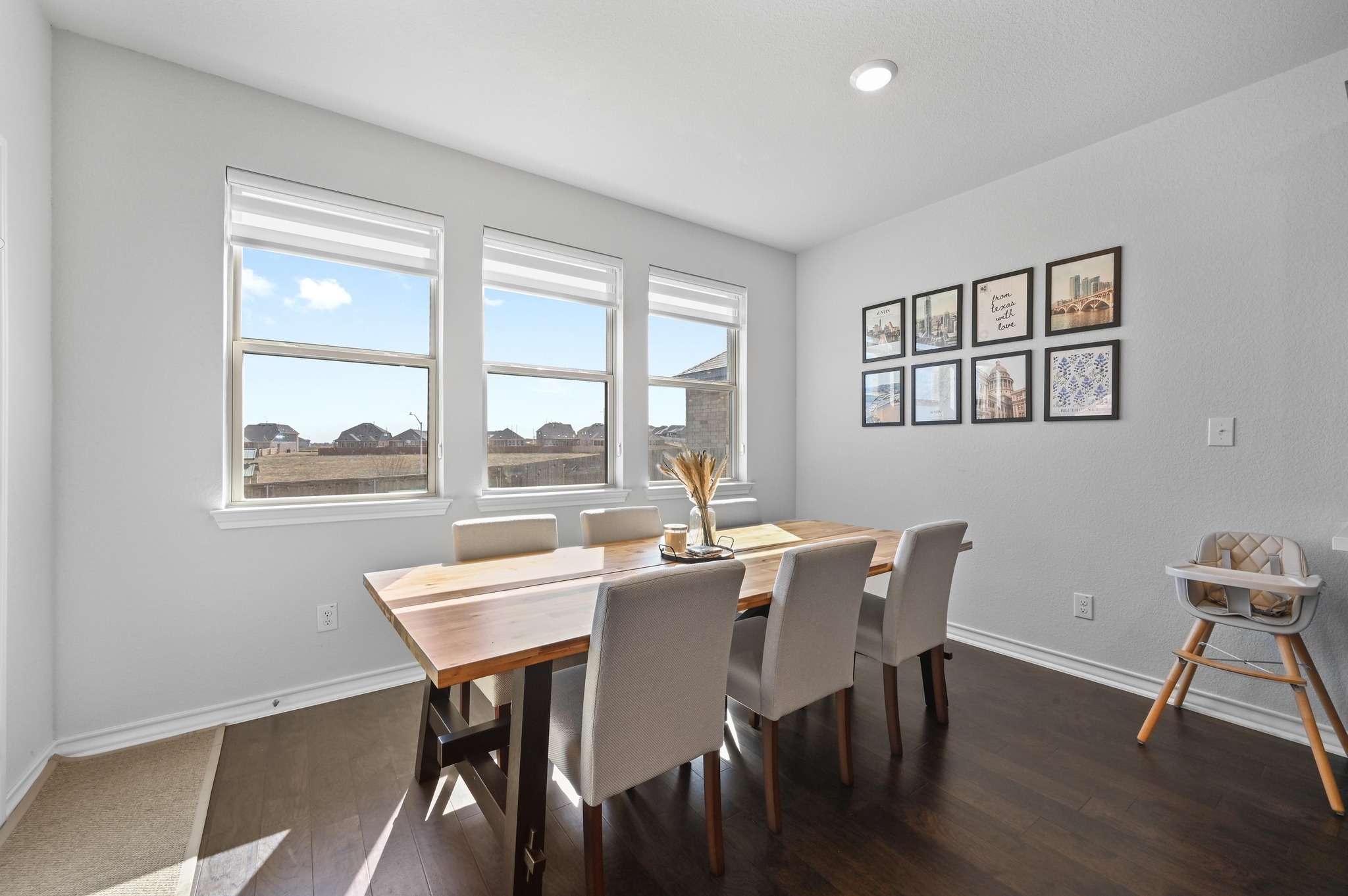 116 Small Seed Drive Buda, TX 78610 - Photo 13 of 40 Dining area featuring dark wood-style floors and baseboards