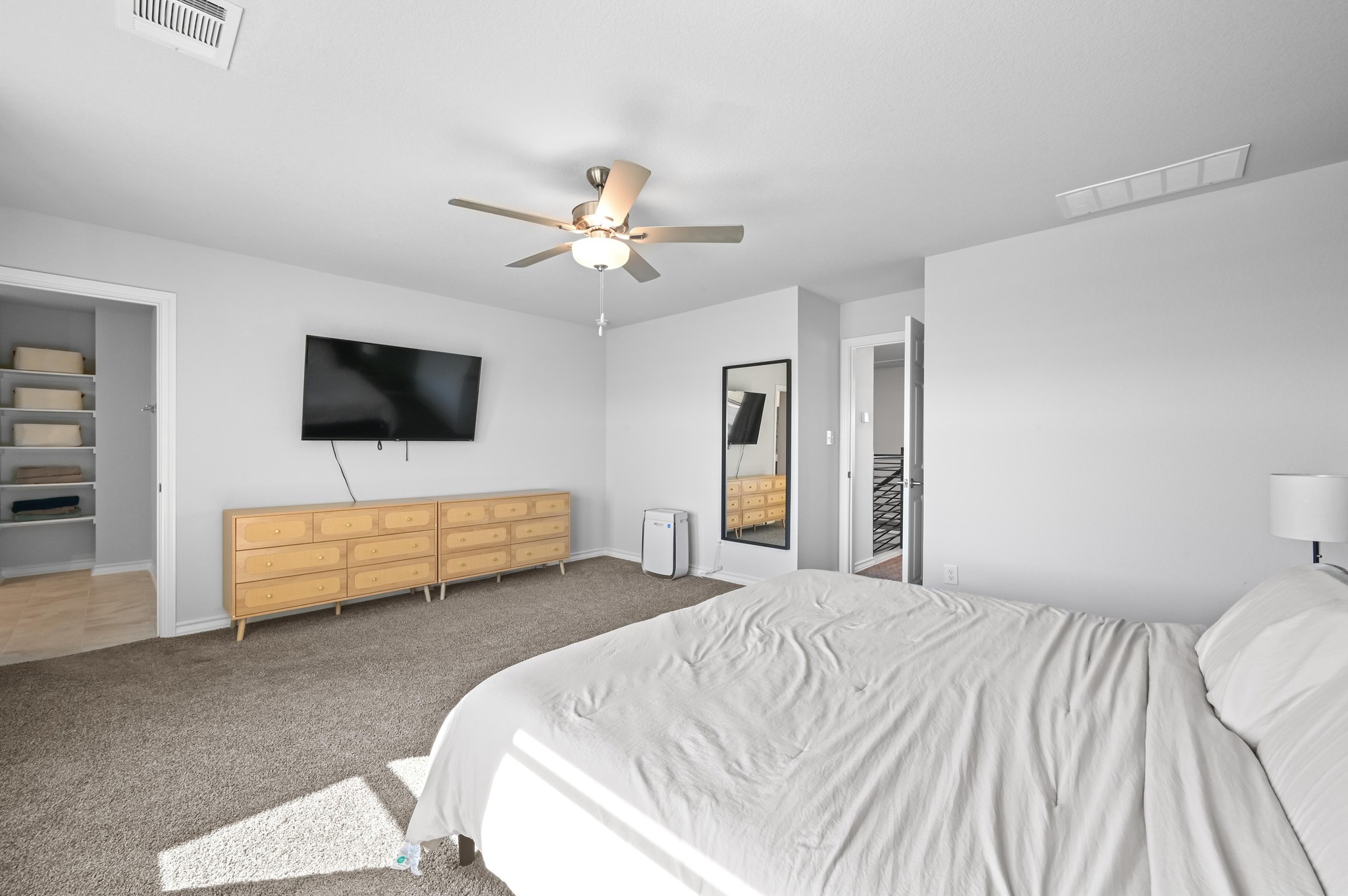 116 Small Seed Drive Buda, TX 78610 - Photo 17 of 40 Carpeted bedroom featuring a ceiling fan and baseboards