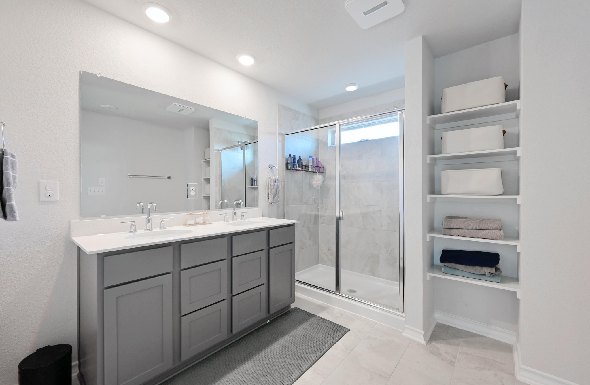 116 Small Seed Drive Buda, TX 78610 - Photo 18 of 40 Bathroom featuring double vanity and a shower stall
