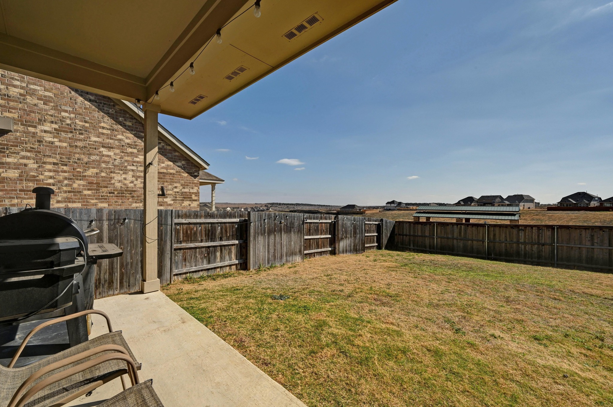 116 Small Seed Drive Buda, TX 78610 - Photo 24 of 40 Fenced backyard with a patio