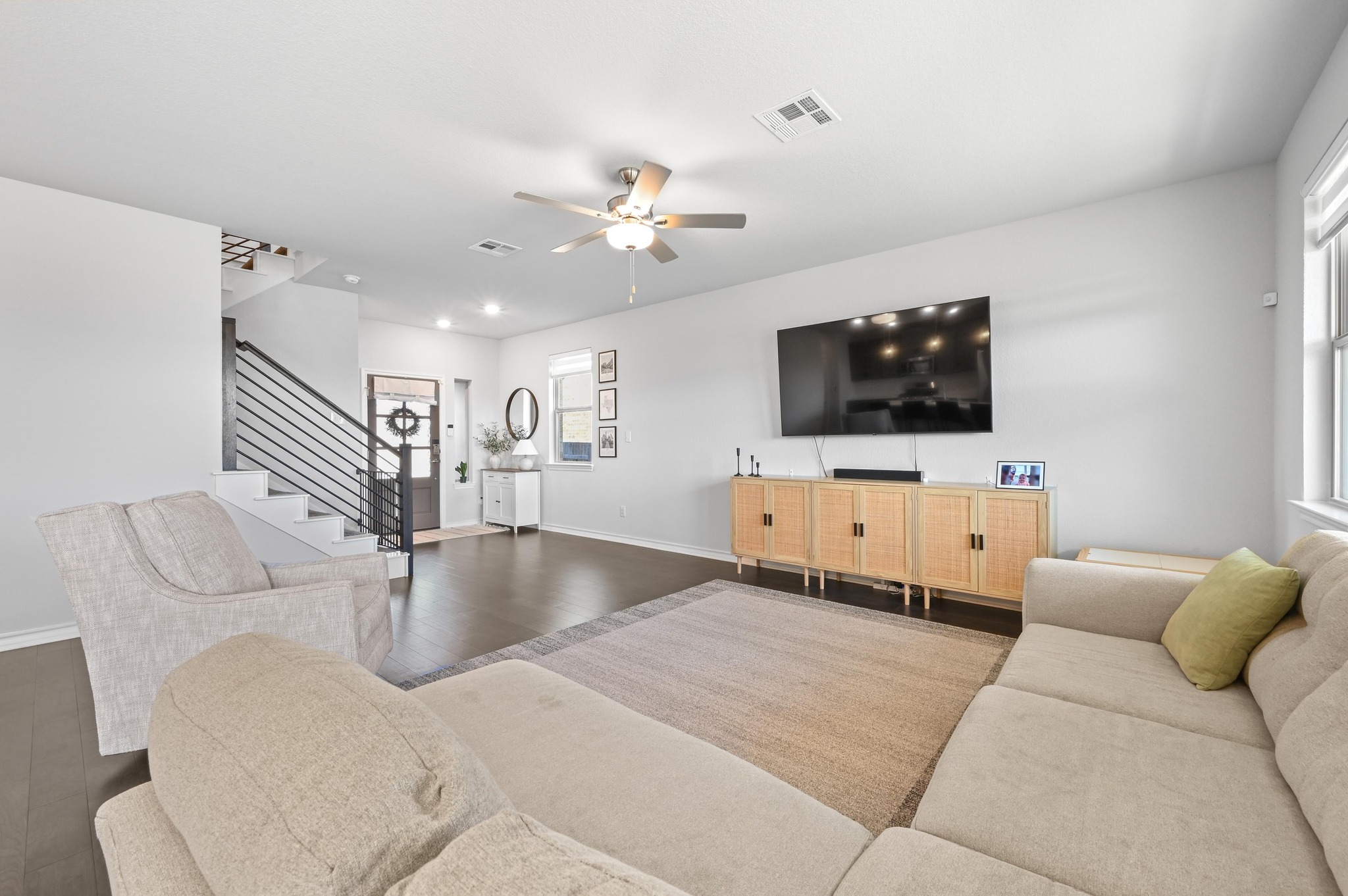 116 Small Seed Drive Buda, TX 78610 - Photo 8 of 40 Living area featuring a ceiling fan and wood finished floors