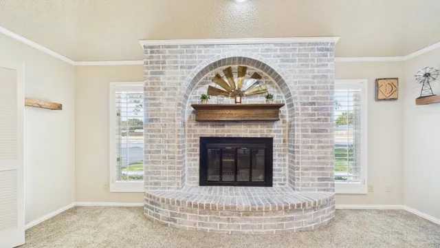 a living room with a fireplace and a fireplace