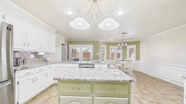 a view of a kitchen counter space a sink and appliances