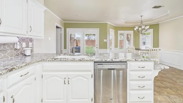 a bathroom with a granite countertop sink mirror and