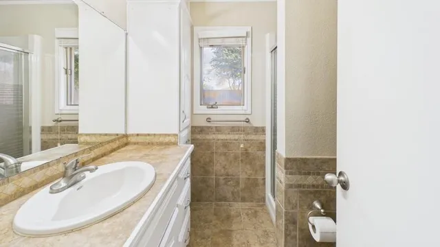 a bathroom with a sink and a mirror