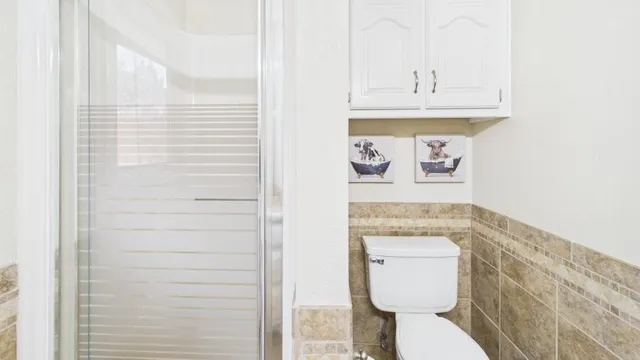 a bathroom with a toilet and a sink