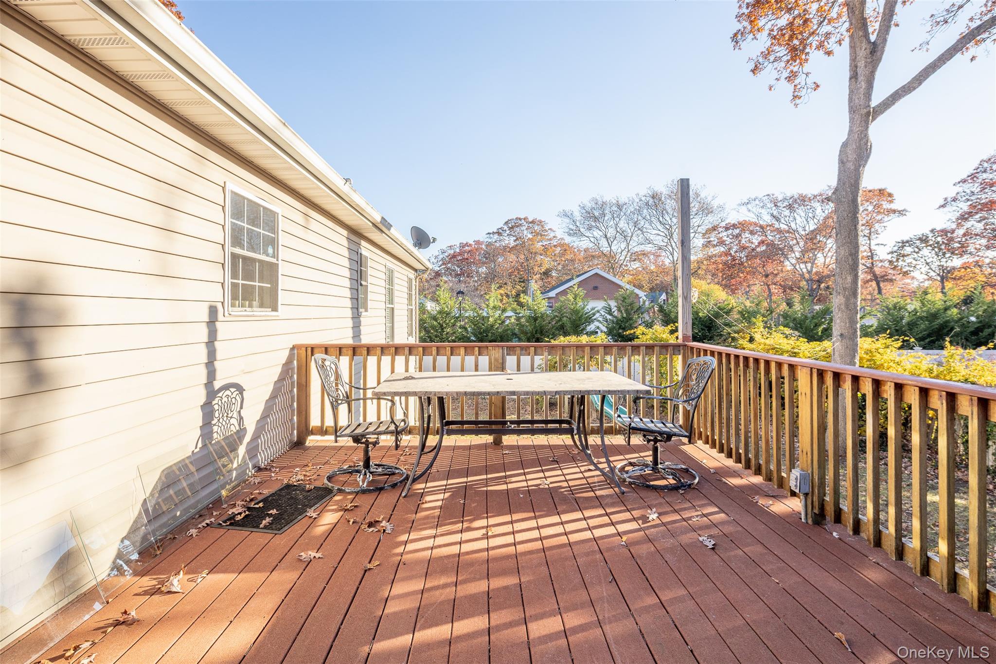 182 Whittier Drive Mastic Beach, NY 11951 - Photo 20 of 25 a view of balcony with wooden floor and outdoor seating