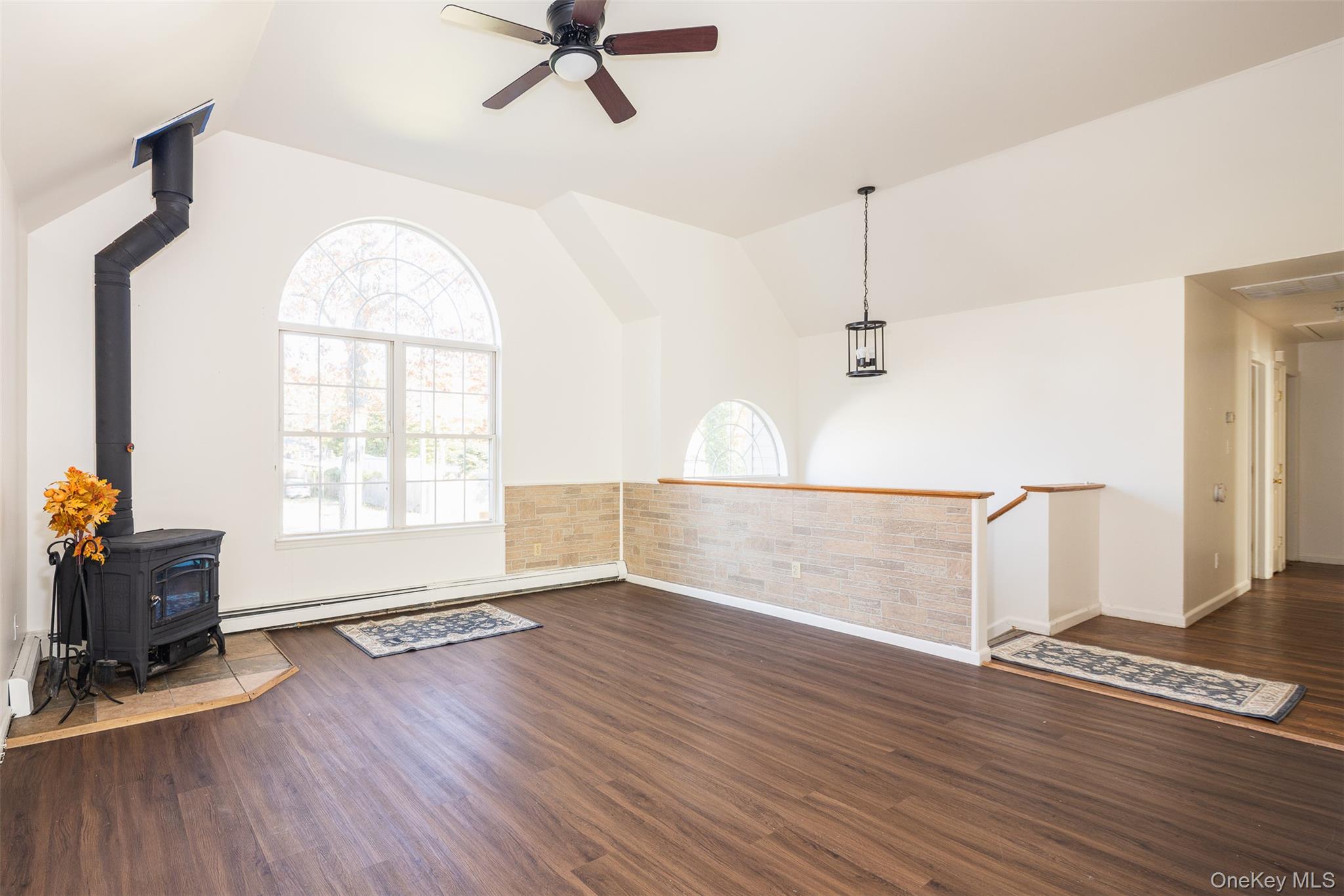 182 Whittier Drive Mastic Beach, NY 11951 - Photo 3 of 25 wooden floor in an empty room with a window