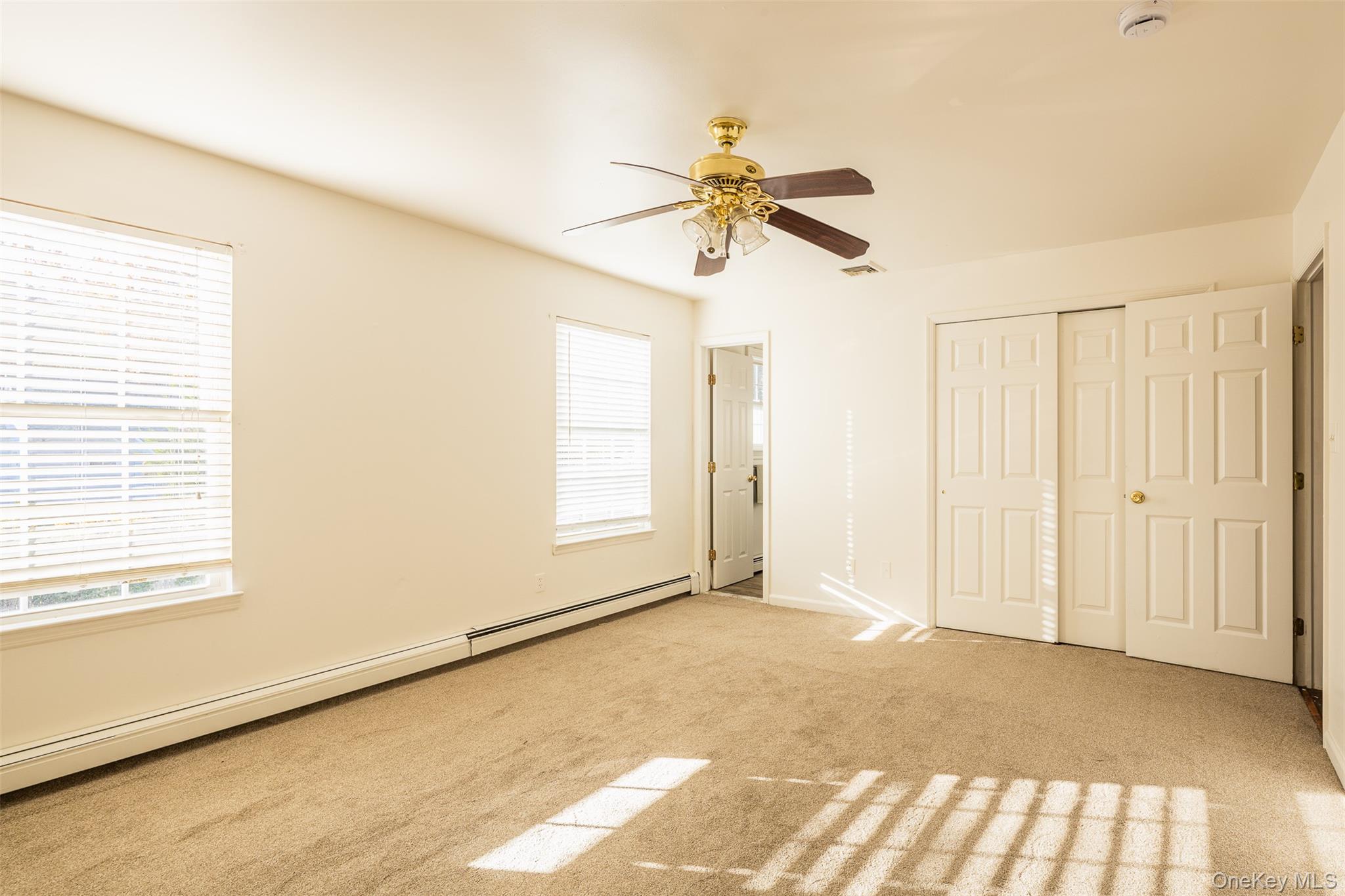 182 Whittier Drive Mastic Beach, NY 11951 - Photo 10 of 25 a view of an empty room and window