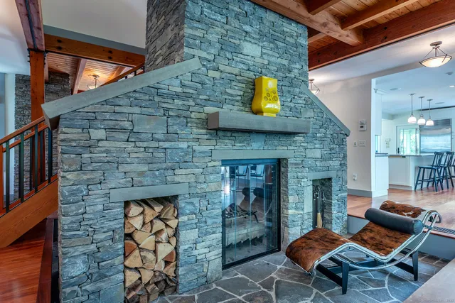 a kitchen with stainless steel appliances granite countertop wooden floors stove and sink