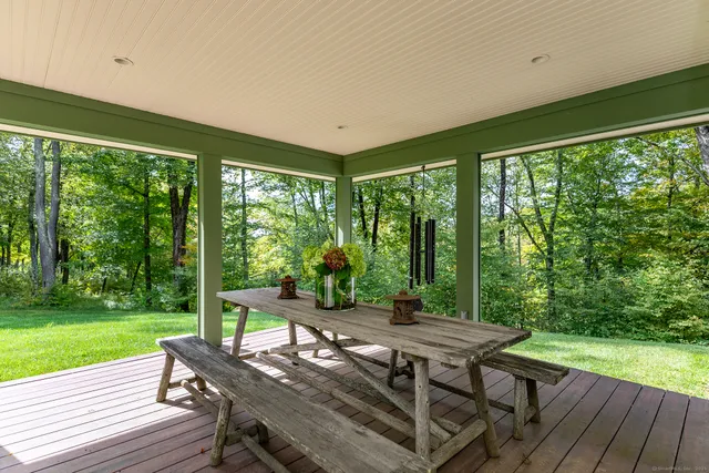 a bedroom with a bed and a lamp on table