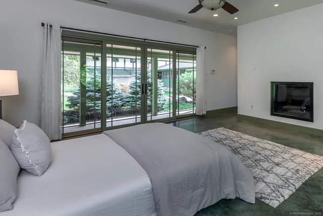 a bath tub sitting in a bathroom next to a window