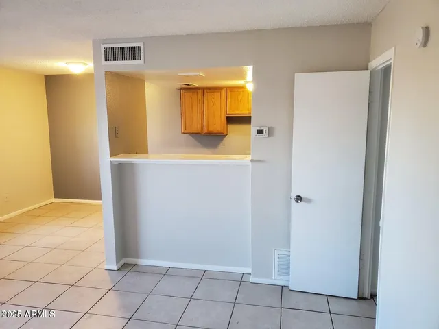 a view of kitchen with furniture and wooden floor