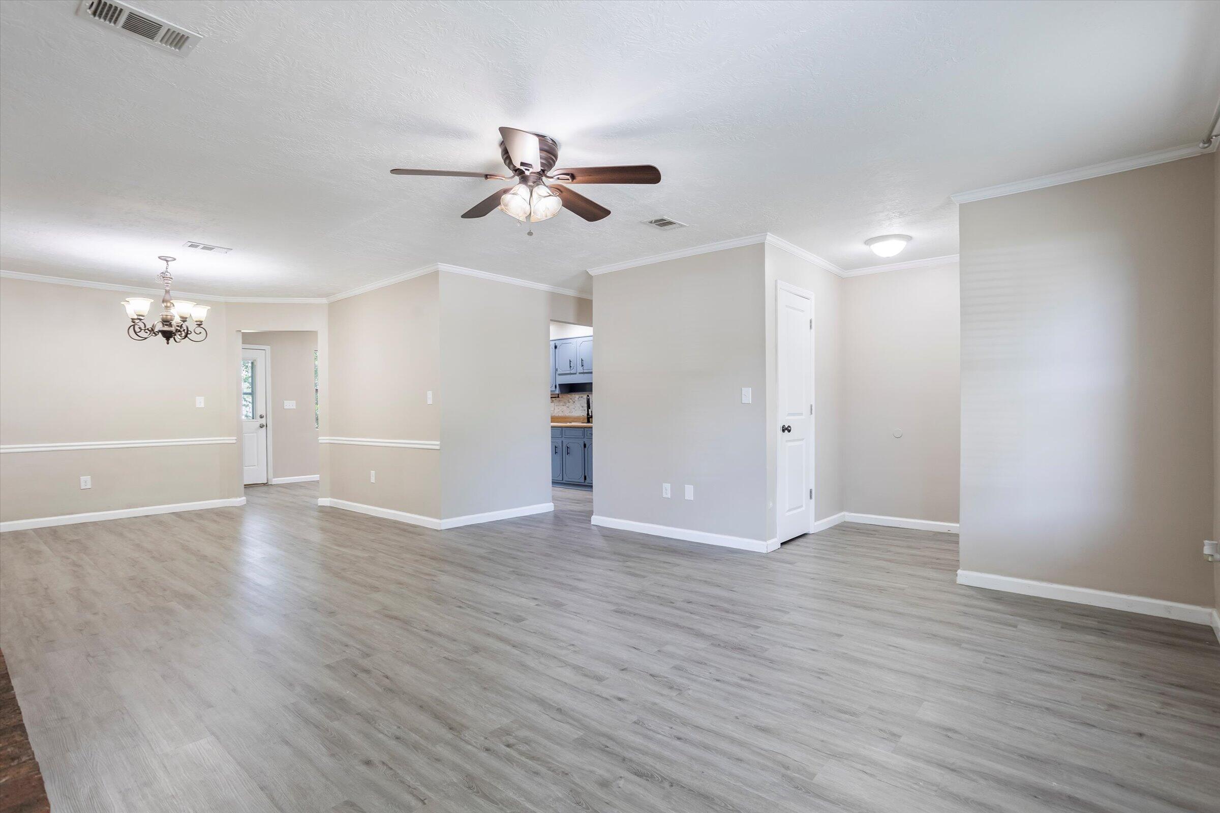 305 Manchester Court Grovetown, GA 30813 - Photo 11 of 13 a view of an empty room with wooden floor