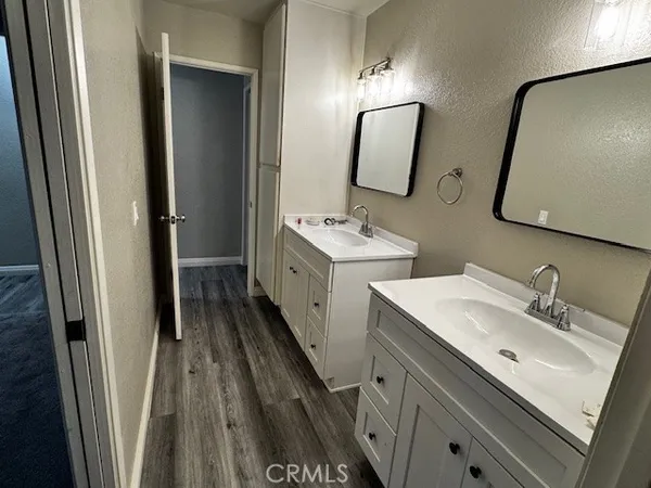 a bathroom with 2 sink and a mirror