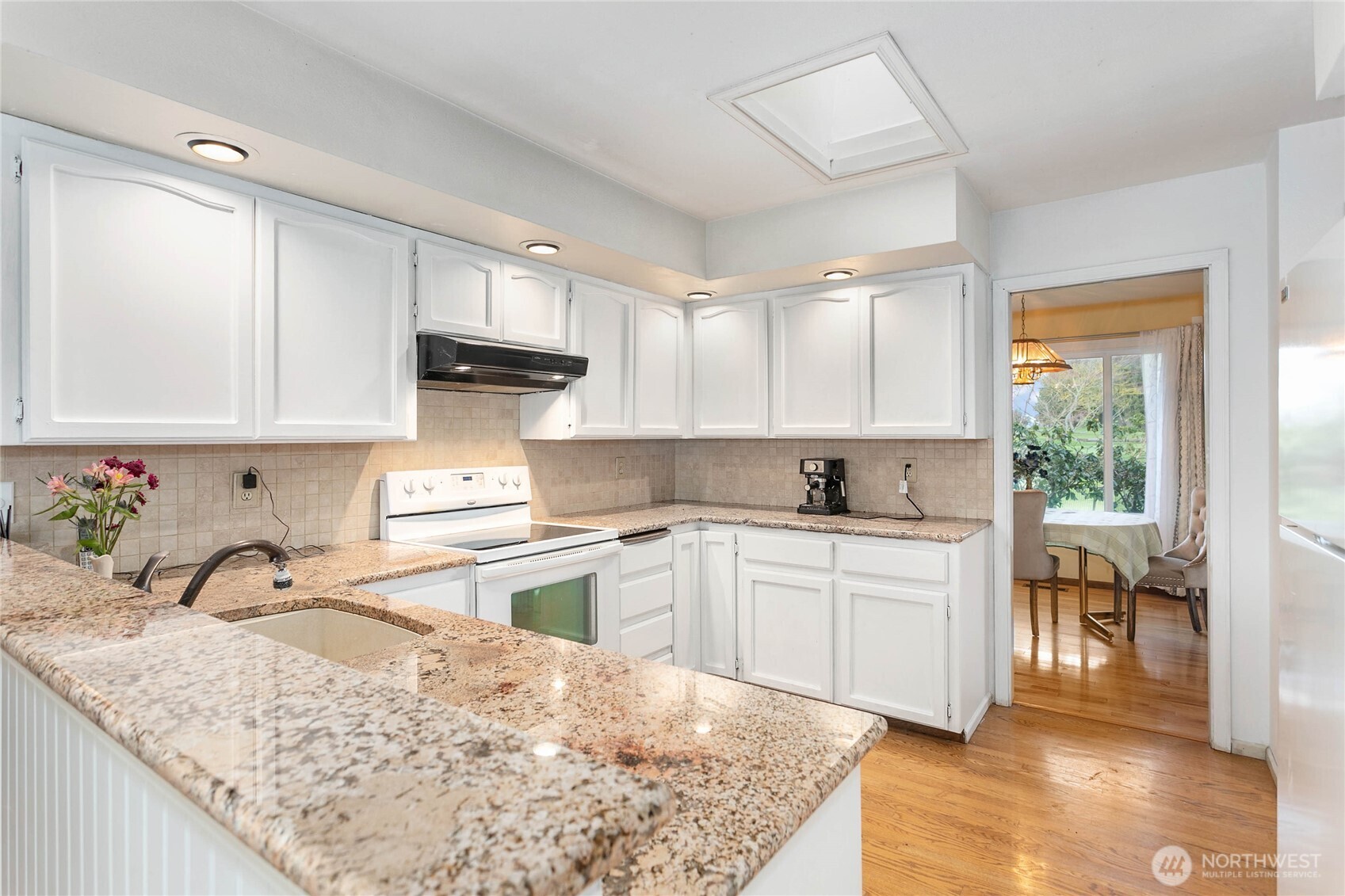 12544 Eagle Drive Burlington, WA 98233 - Photo 13 of 34 a kitchen with a stove top oven sink and cabinets