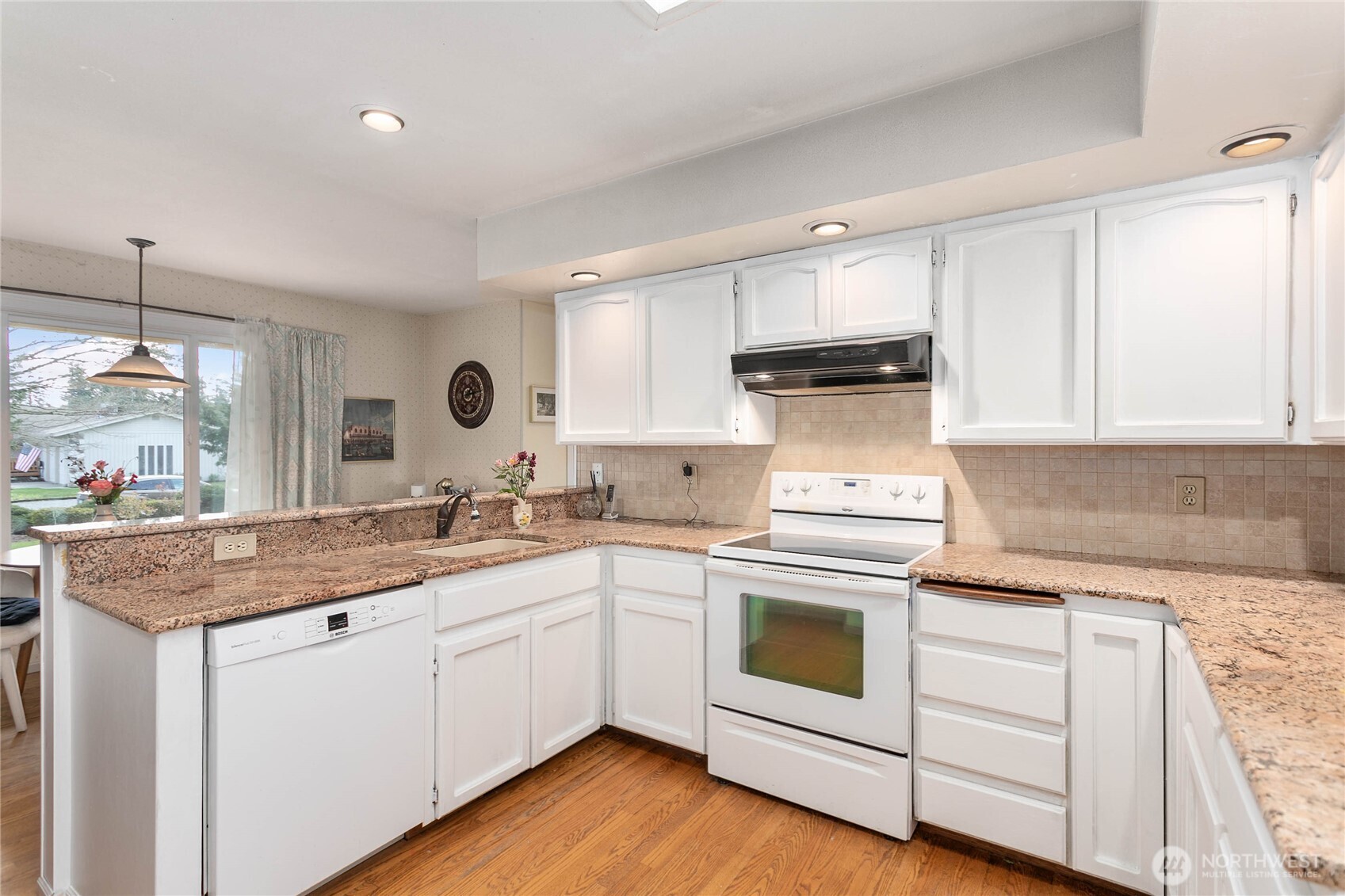 12544 Eagle Drive Burlington, WA 98233 - Photo 15 of 34 a kitchen with a stove sink and cabinets