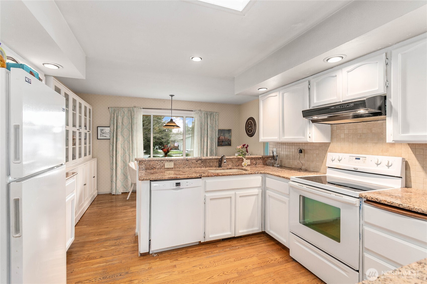 12544 Eagle Drive Burlington, WA 98233 - Photo 16 of 34 a kitchen with a stove top oven sink and cabinets