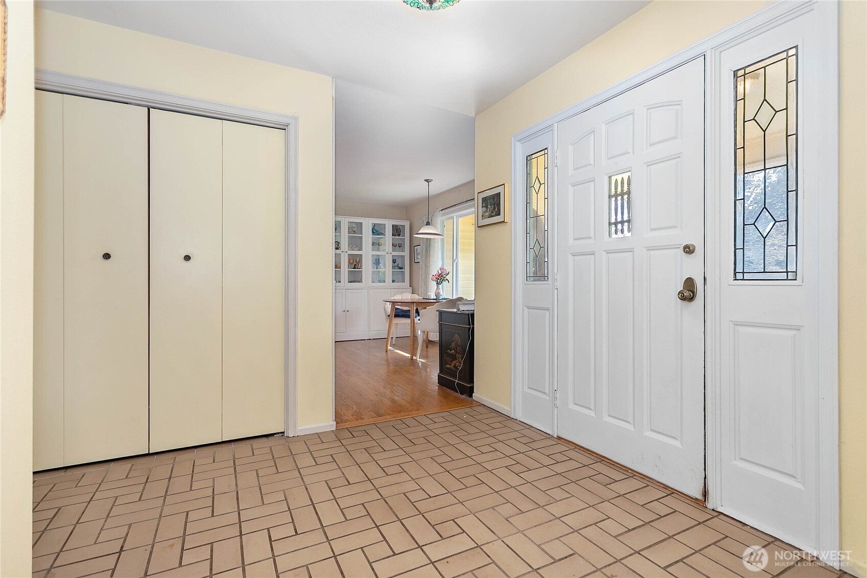 12544 Eagle Drive Burlington, WA 98233 - Photo 3 of 34 a view of a hallway with wooden floor and a bathroom