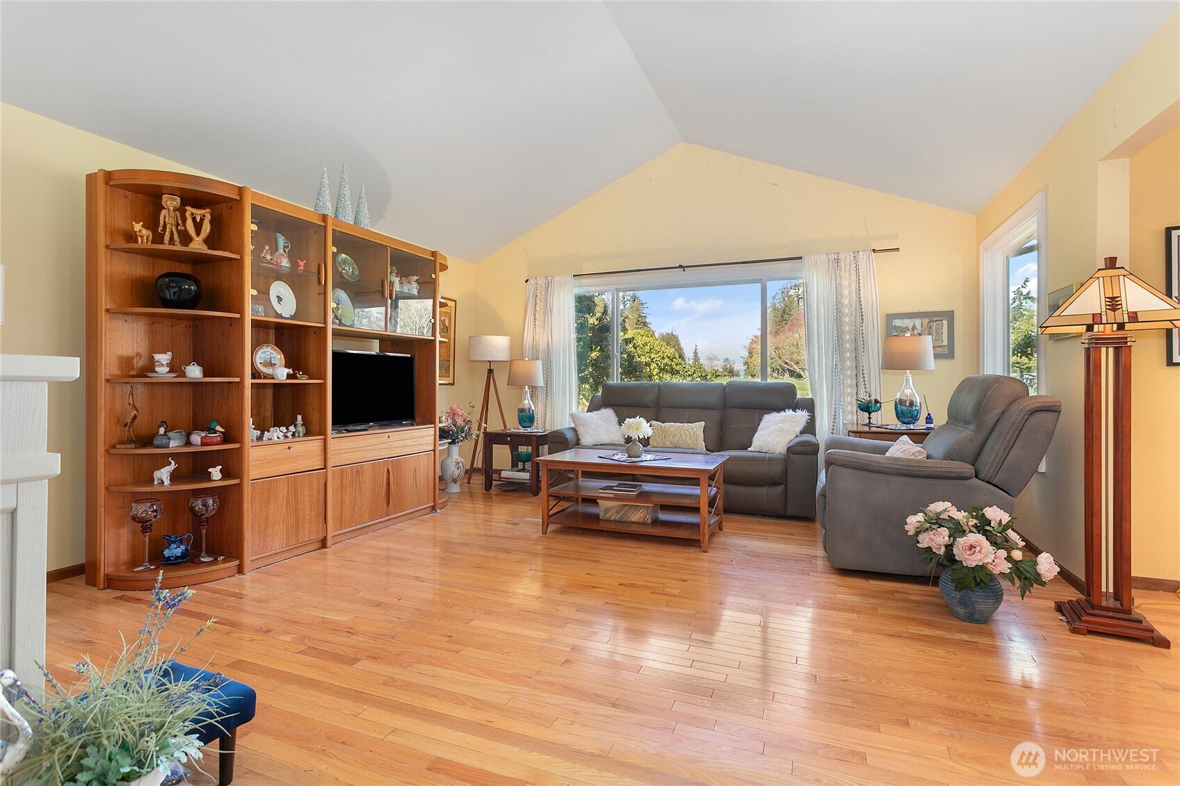 12544 Eagle Drive Burlington, WA 98233 - Photo 6 of 34 a living room with furniture cabinets and a flat screen tv
