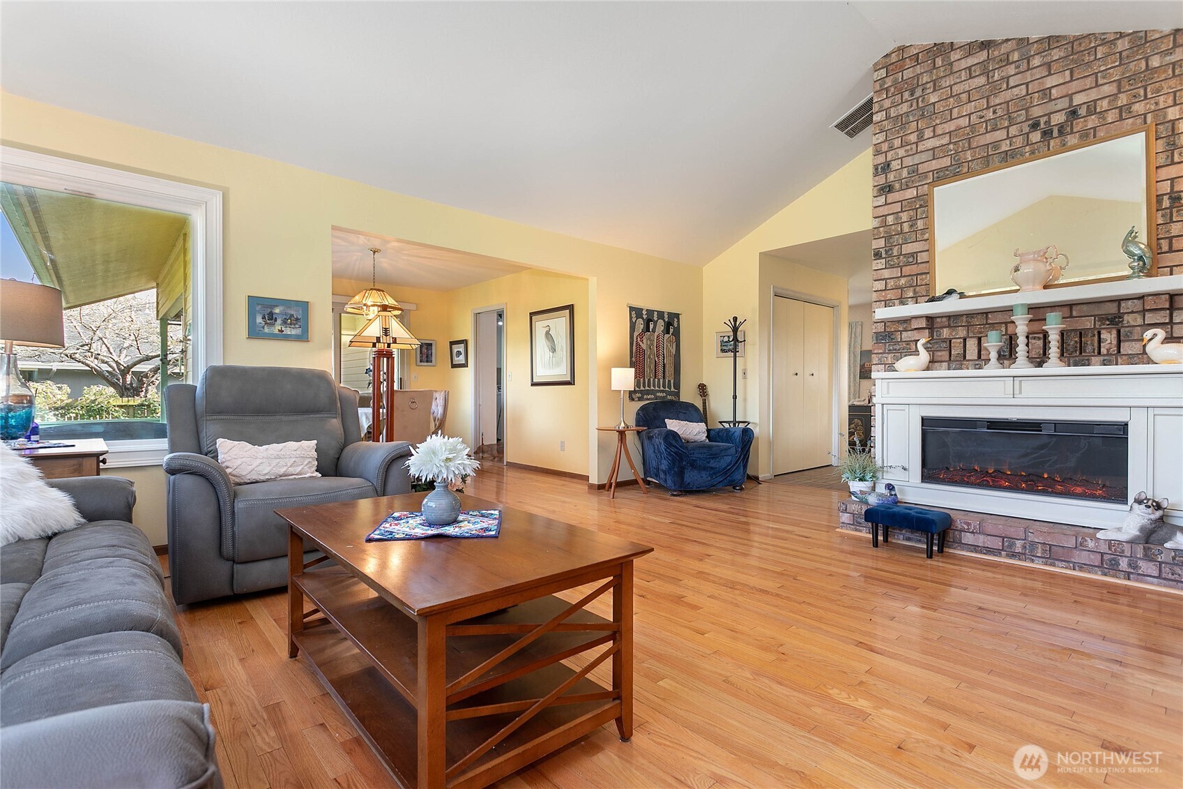 12544 Eagle Drive Burlington, WA 98233 - Photo 9 of 34 a living room with furniture a fireplace and a large window