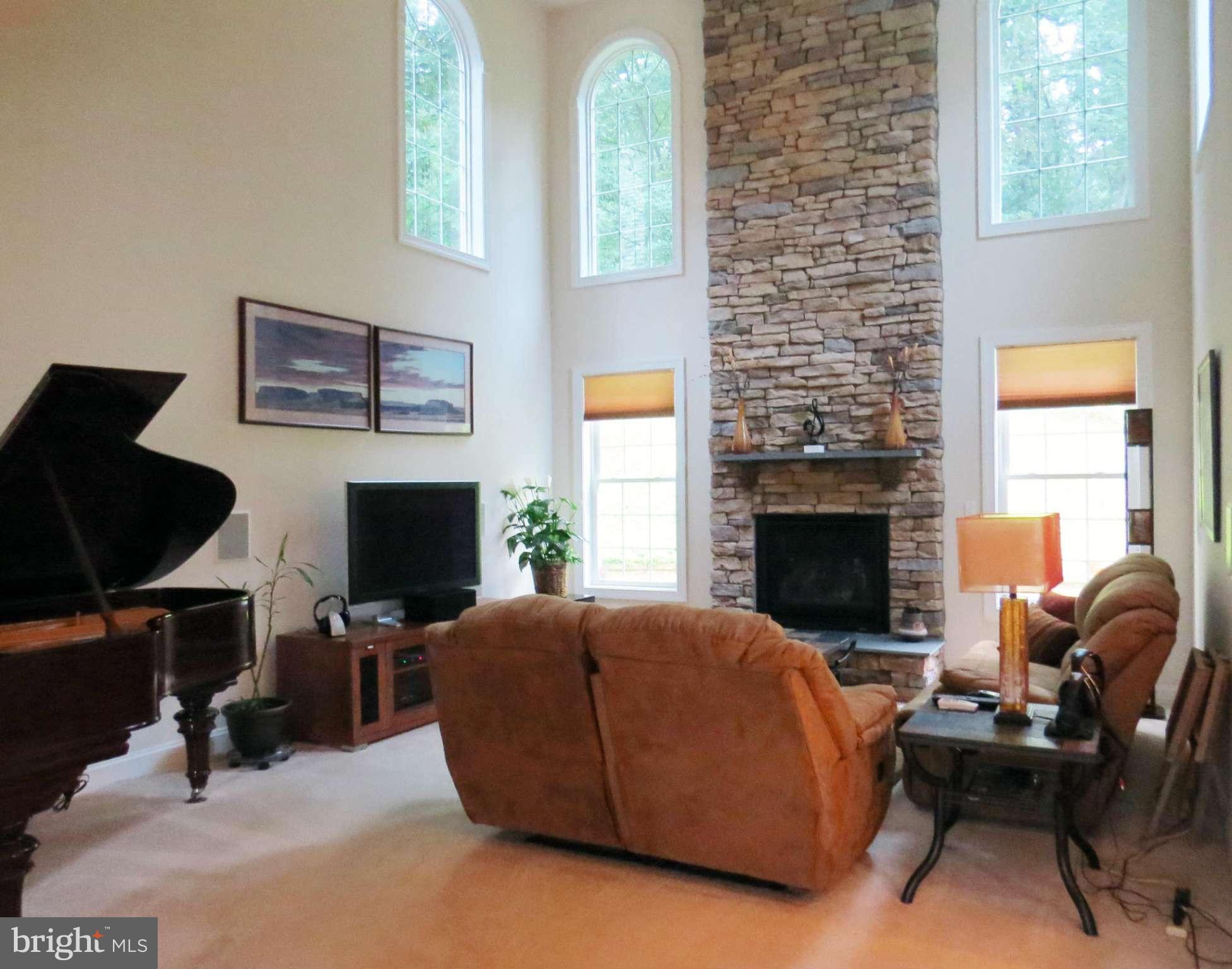 7650 Talbot Run Road Mount Airy, MD 21771 - Photo 2 of 15 a living room with furniture and a fireplace