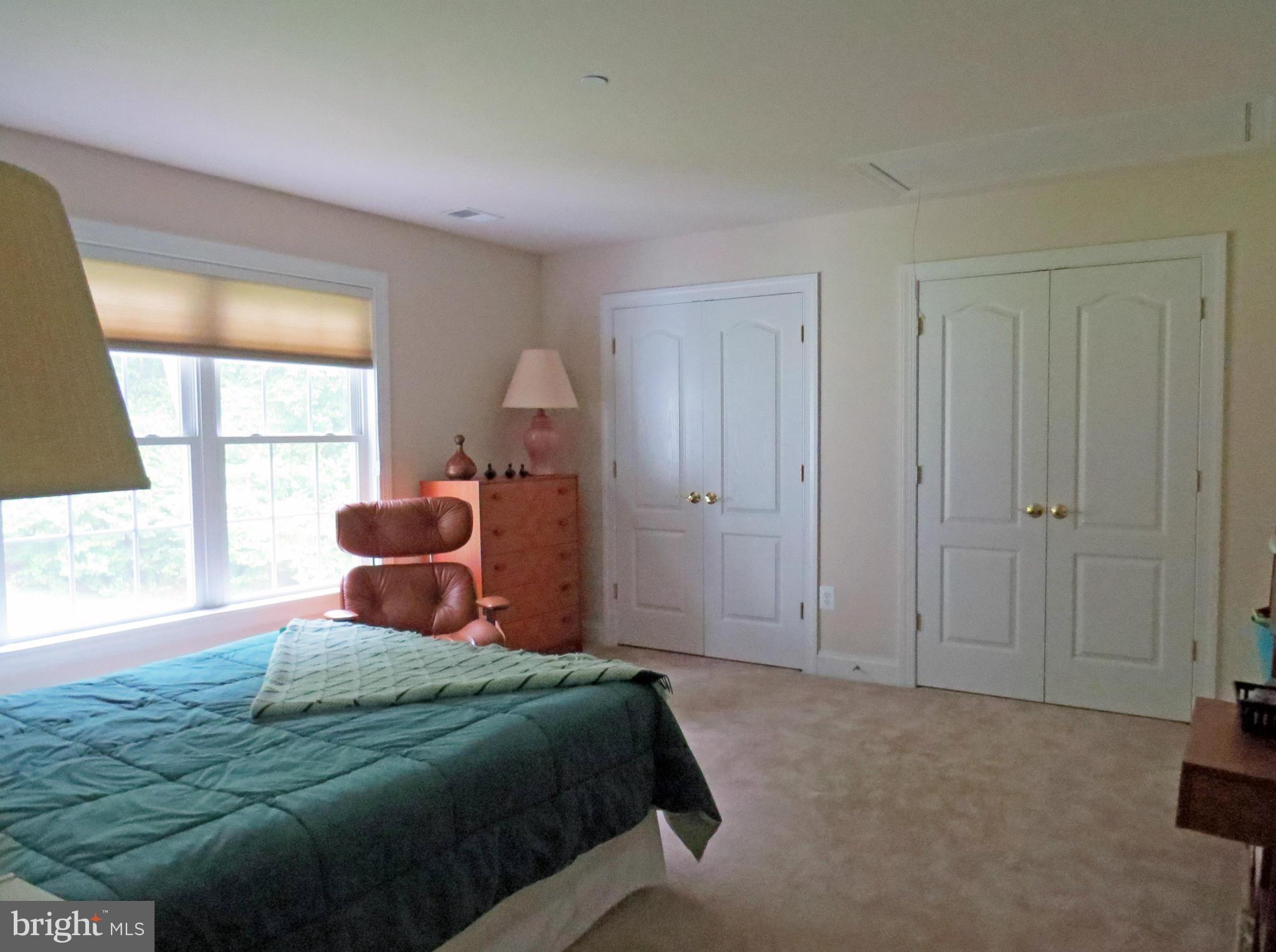 7650 Talbot Run Road Mount Airy, MD 21771 - Photo 13 of 15 a bedroom with a bed and a large window