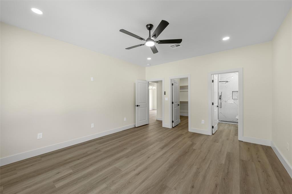 3320 North 27th Street Waco, TX 76708 - Photo 21 of 38 a view of an empty room with wooden floor and a ceiling fan