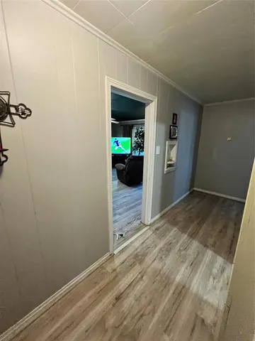 a view of a small space with wooden floor