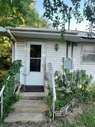 a view of empty room with wooden ceiling
