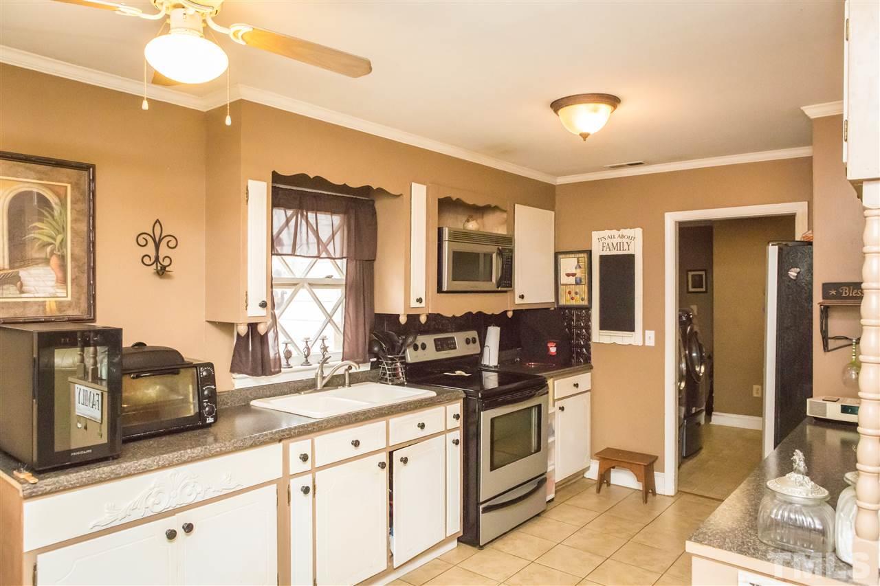 429 South Morgan Street Roxboro, NC 27573 - Photo 14 of 25 a kitchen with stainless steel appliances a counter top space cabinets and a sink