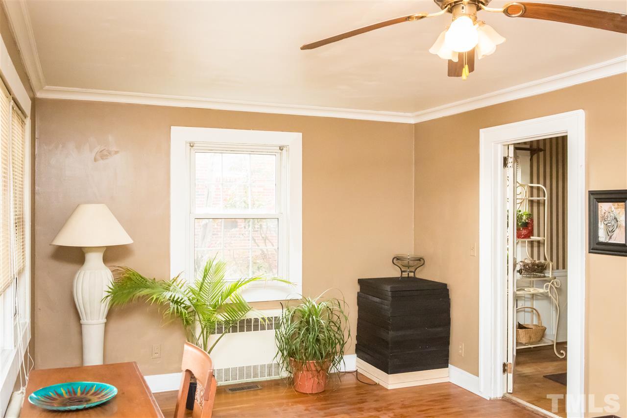 429 South Morgan Street Roxboro, NC 27573 - Photo 8 of 25 a living room with furniture and a potted plant