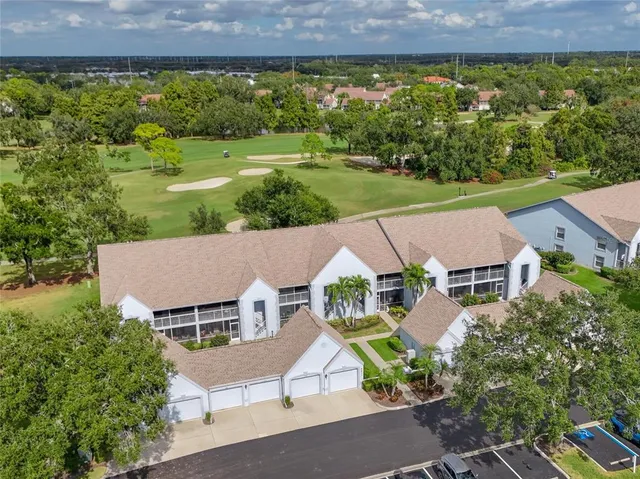 an aerial view of a house with garden space and street view