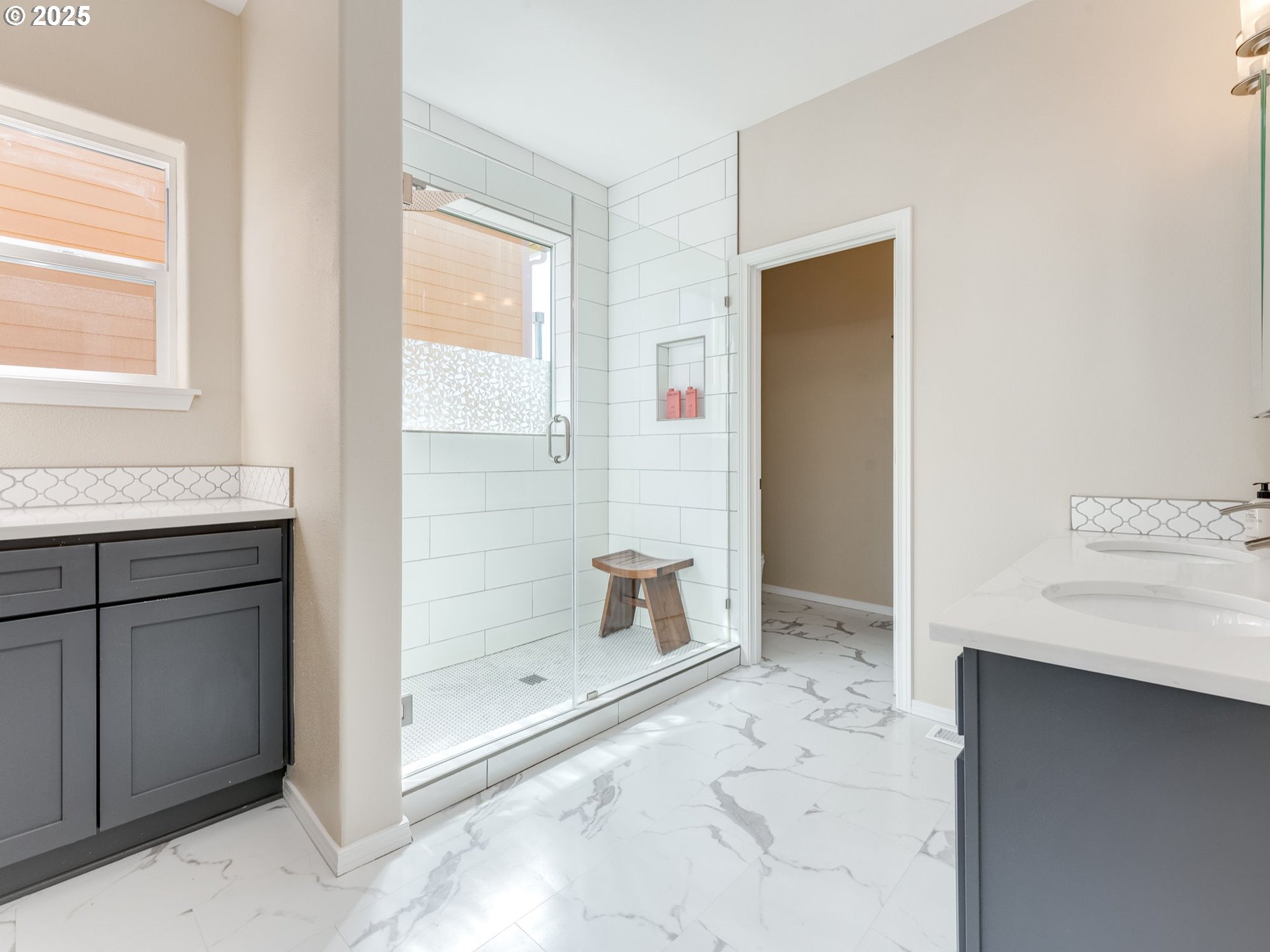 5641 Southeast Chase Loop Gresham, OR 97080 - Photo 15 of 39 a bathroom with a granite countertop sink a mirror and a shower