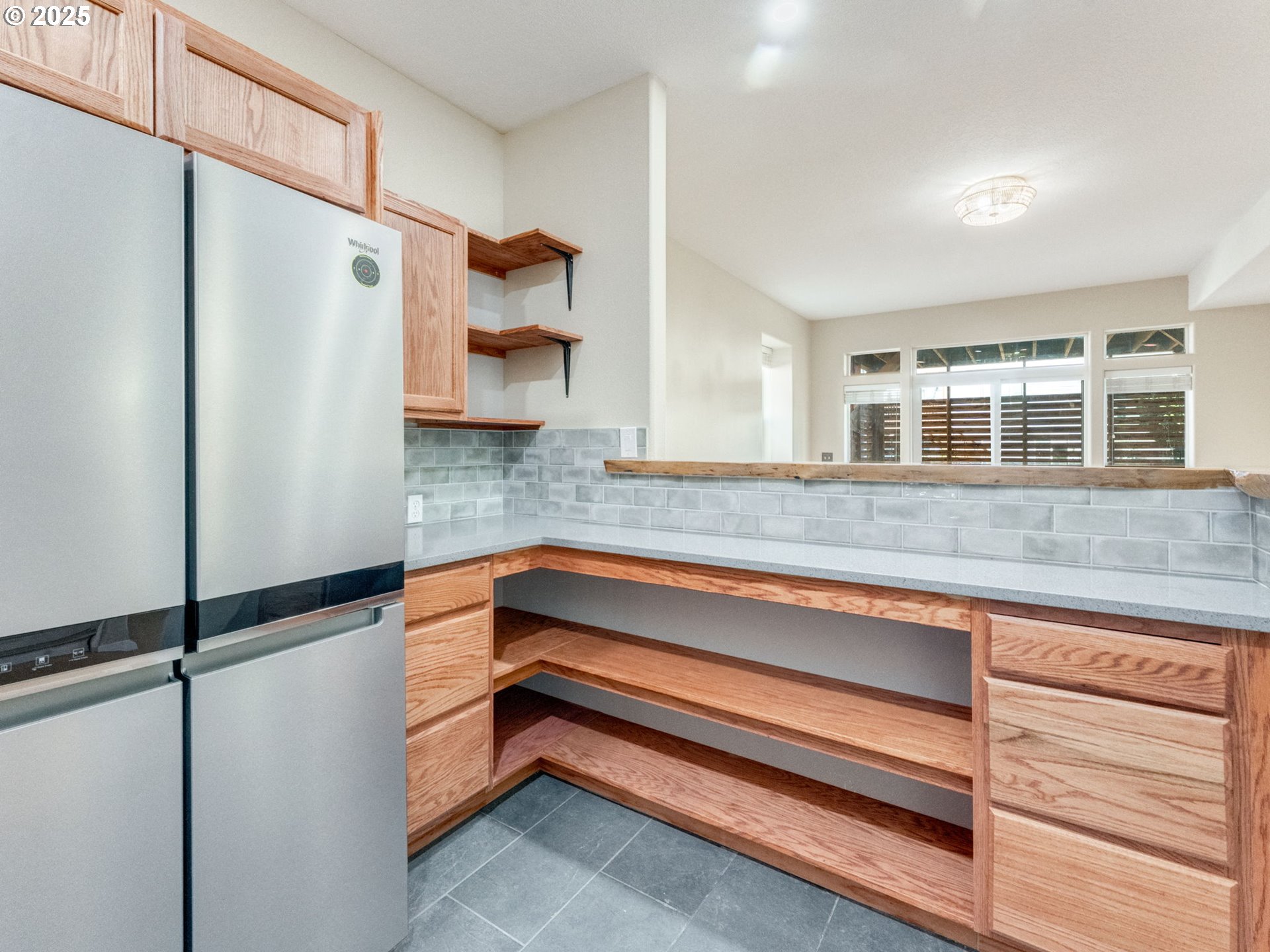 5641 Southeast Chase Loop Gresham, OR 97080 - Photo 27 of 39 a kitchen with a refrigerator and a sink