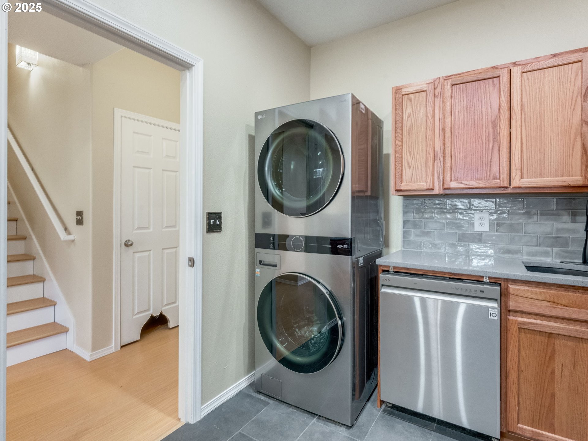 5641 Southeast Chase Loop Gresham, OR 97080 - Photo 28 of 39 a view of a hallway with washer and dryer