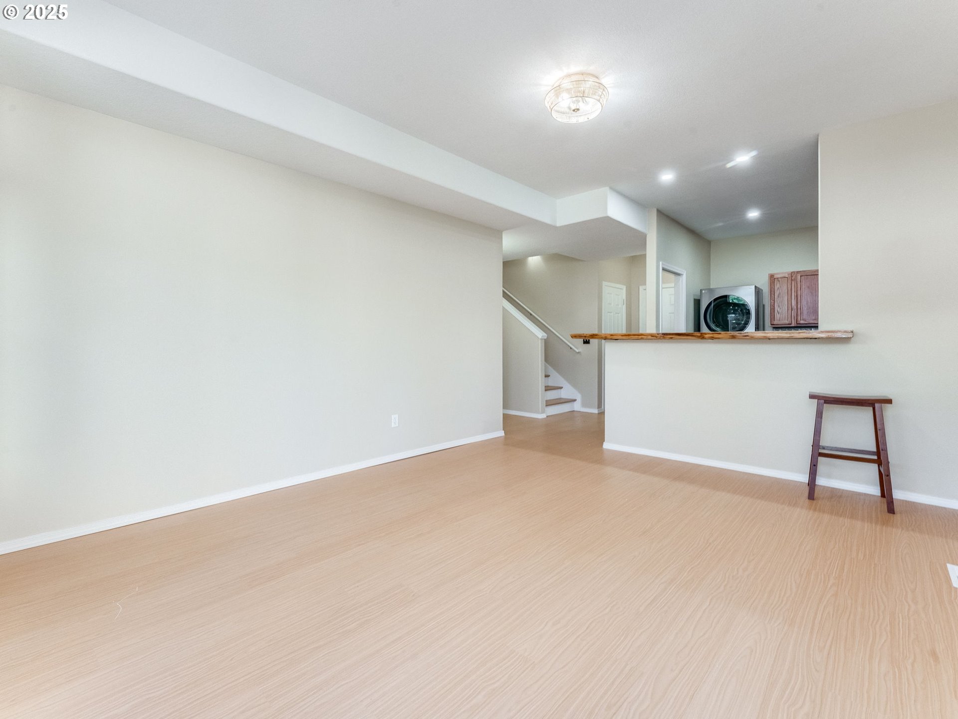 5641 Southeast Chase Loop Gresham, OR 97080 - Photo 30 of 39 an empty room with a kitchen