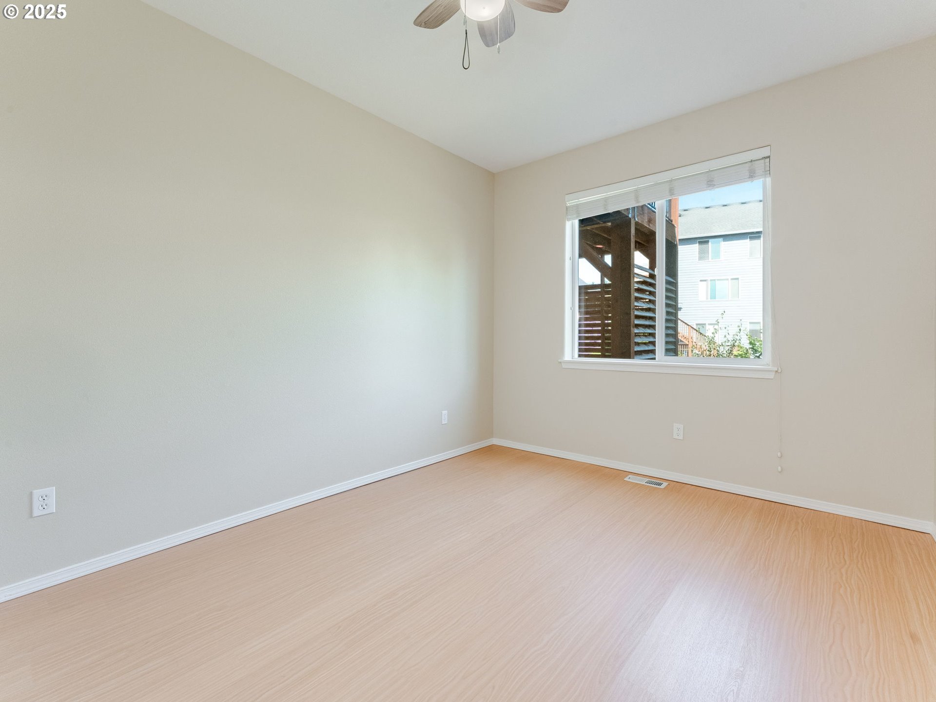 5641 Southeast Chase Loop Gresham, OR 97080 - Photo 32 of 39 an empty room with a window