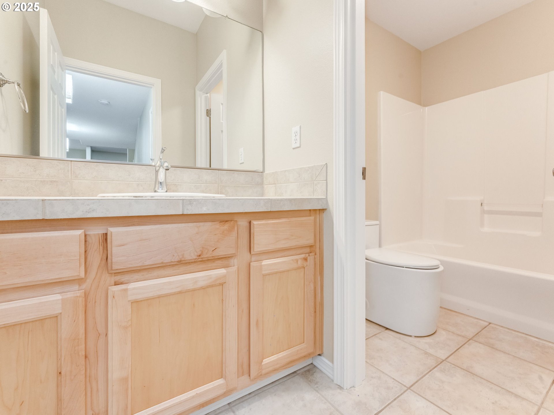 5641 Southeast Chase Loop Gresham, OR 97080 - Photo 35 of 39 a bathroom with a granite countertop sink and a mirror