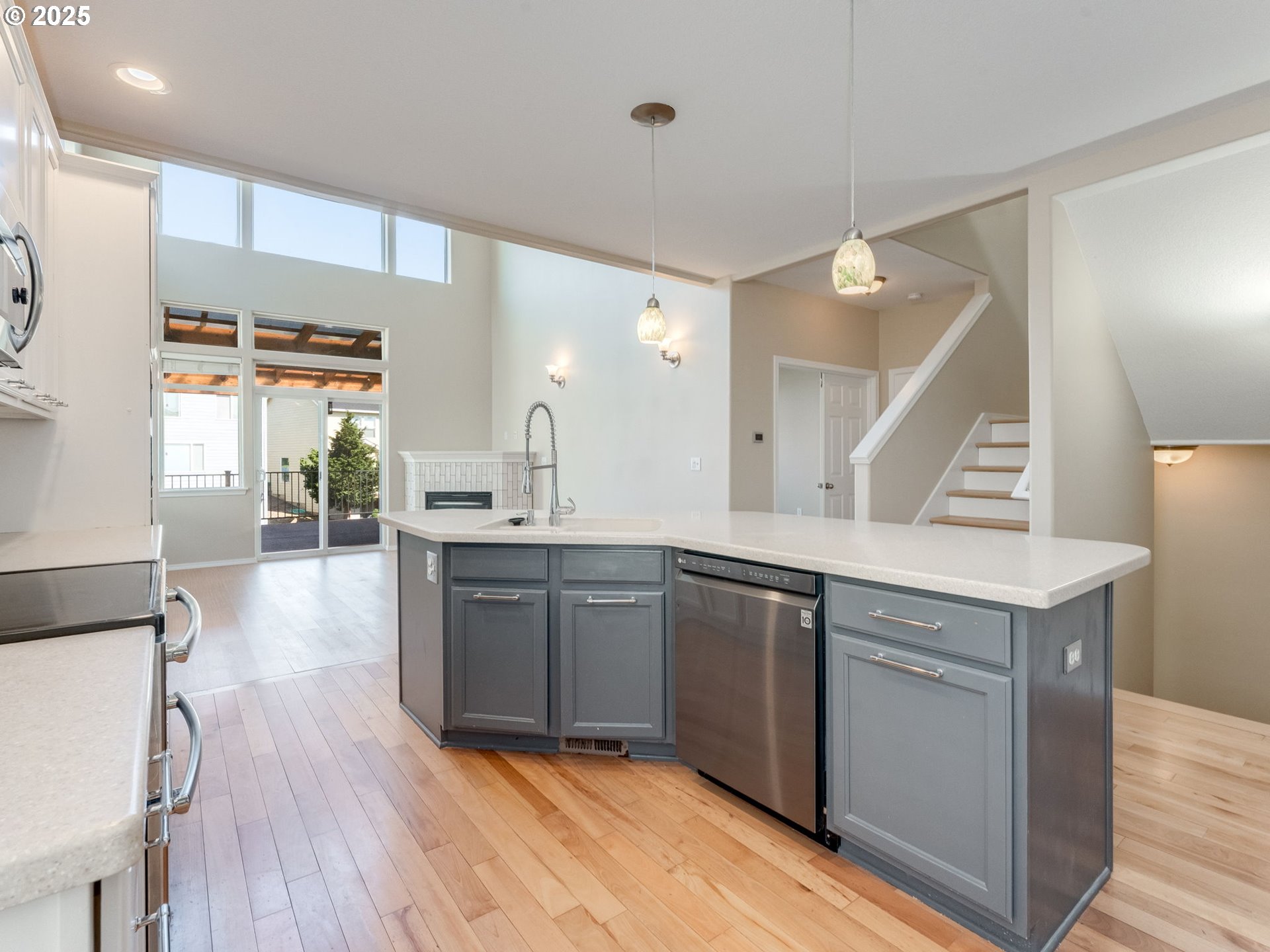 5641 Southeast Chase Loop Gresham, OR 97080 - Photo 7 of 39 a large kitchen with cabinets wooden floor and a sink