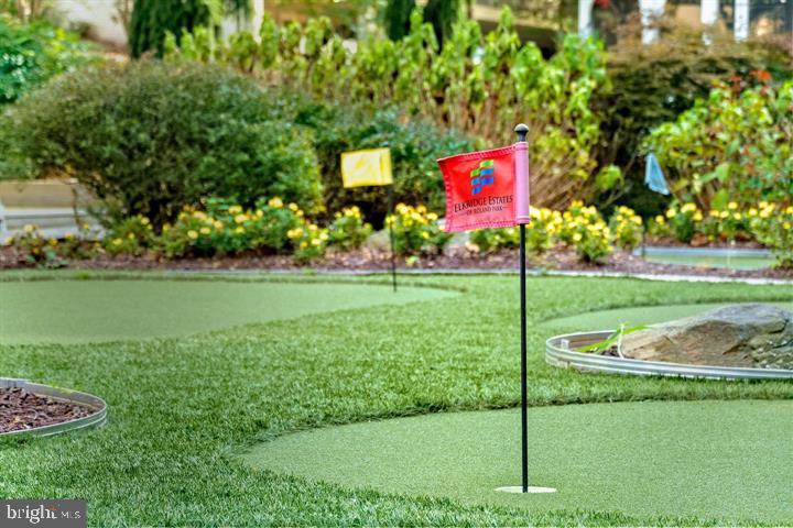6001 Hunt Ridge Road, Unit 3622 Baltimore, MD 21210 - Photo 16 of 20 a sign that is sitting in the grass near a yard