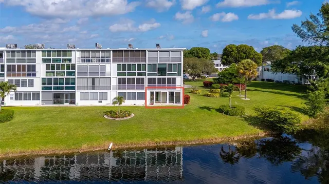 a view of a swimming pool with an outdoor seating