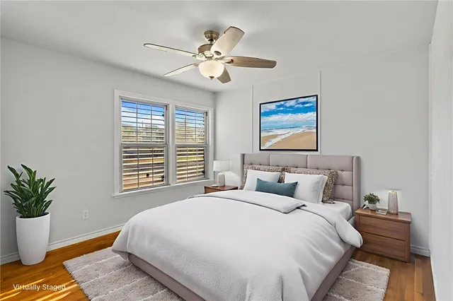 a bedroom with a large bed and a window